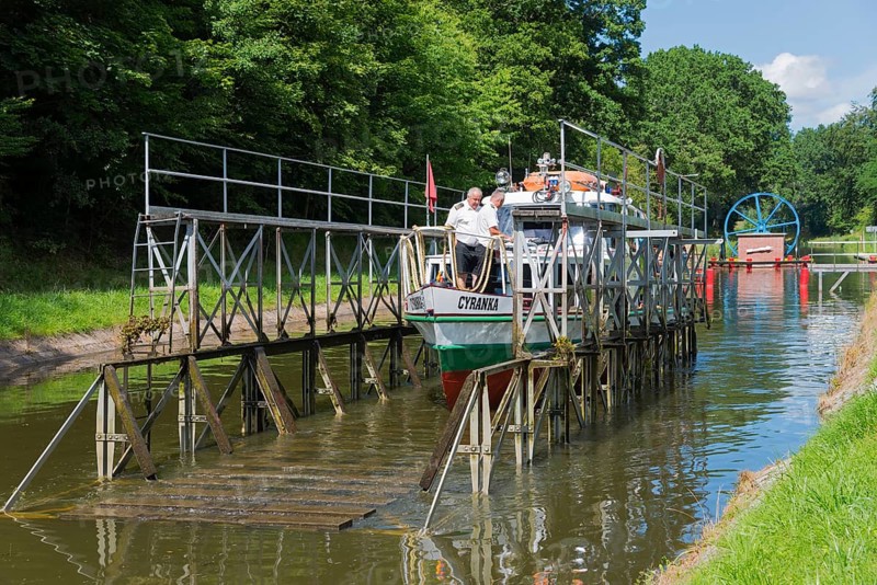 Boat on a rail wagon, surrounded by trees on a canal, ship Cyranka, Upland Canal, Warminsko-Mazurskie, Poland, Upland Canal, Elbling Osterode Canal, Elblag-Ostroda Canal, Warminsko-Mazurskie, Poland, Europe