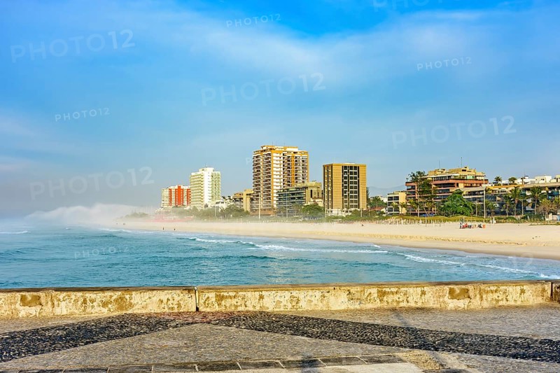 Morning on the breakwater of Barra da Tijuca beach, one of the most famous in the city of Rio de Janeiro with its buildings facing the sea Rio de Janeiro, Barra da Tijuca, RJ, Brazil, South America