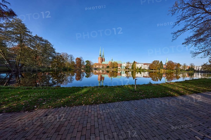 Long shot of the mill pond, park, trees, Lübeck Cathedral, symmetrical reflections on the water surface, Hanseatic city of Lübeck, Schleswig-Holstein, Germany, Europe