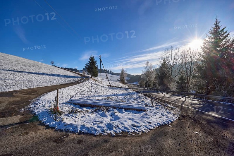 Hilly snowy landscape, roads, conifers, blue sky with veil clouds, Jostalstraße, Titisee-Neustadt, Black Forest, Breisgau-Hochschwarzwald district, Baden-Württemberg, Germany, Europe