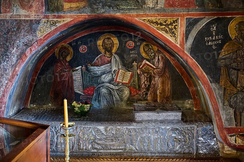 Medieval fresco depicting Christ and two saints surrounded by Gothic elements and a candle on a carved altar, Inside the monastery, Agiou Theologou Monastery, Chora, Patmos, Dodecanese, Greek Islands, Greece, Europe