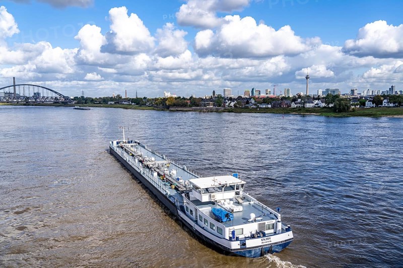 Skyline of Düsseldorf, cargo ship, tanker Enjoy, office tower blocks, residential buildings in Düsseldorf-Hamm, North Rhine-Westphalia, Germany, Europe