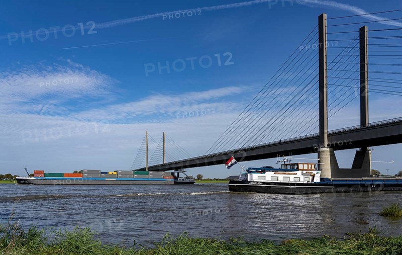 Cargo ships on the Rhine near Rees, Rhine bridge Rees-Kalkar, road bridge, federal road B67, North Rhine-Westphalia, Germany, Europe