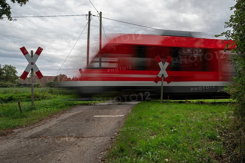Passing Gräfenberg railway, single-track branch line, at the unrestricted level crossing, Igensdorf, Upper Franconia, Bavaria, Germany, Europe