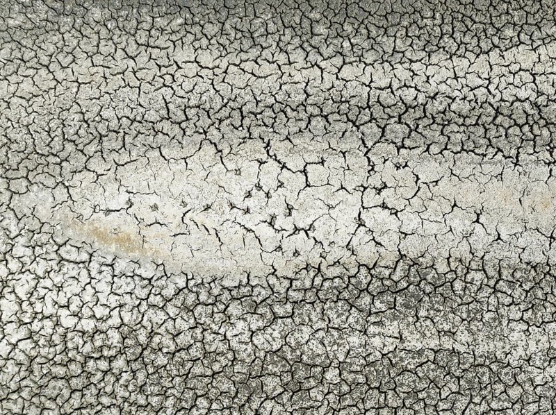 Cracked earth in the marshland near Sanlúcar de Barrameda. Aerial view. Drone shot. Cádiz province, Andalusia, Spain, Europe