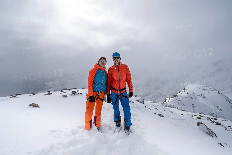 Two ski tourers, couple on the summit of the Köllkuppe or Cima Marmota, snow-covered mountain landscape, Ortler Alps, Vinschgau, Italy, Europe