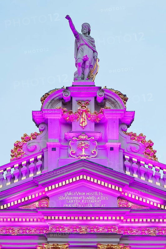 The illuminated statue of Bishop Boniface of Lausanne on the guildhall La Chaloupe d'Or, Grand-Place, Grote Markt, Brussels, Belgium, Europe
