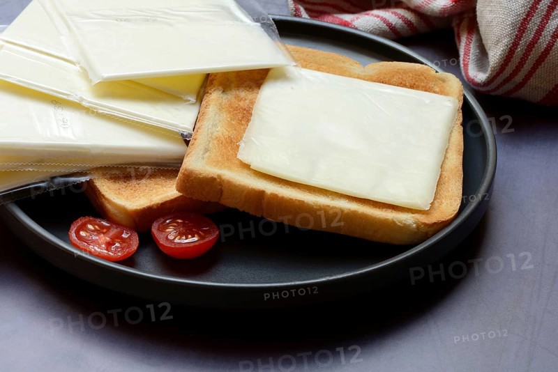 Cheese slices with toast, processed cheese in packaging