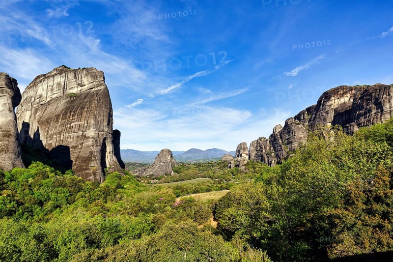 Hermitages between high rocks, monasteries on sandstone formations, Meteora, blue sky, spring weather, Thessaly, Greece, Europe