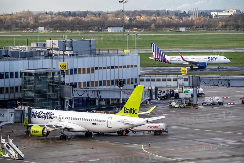 Düsseldorf Airport, Sky Express aircraft on the taxiway for take-off, Air Baltic aircraft at Terminal A, Düsseldorf, North Rhine-Westphalia, Germany, Europe