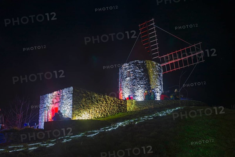 Historic windmill at night, illuminated with red and blue modern lights, on a hill, world of lights, illumination, mill museum, Gifhorn, Lower Saxony, Germany, Europe