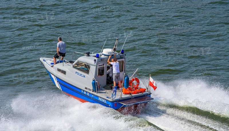 Police boat at full speed on the river Swina in Swinoujscie, Western Pomerania, Poland, Eastern Europe, Europe
