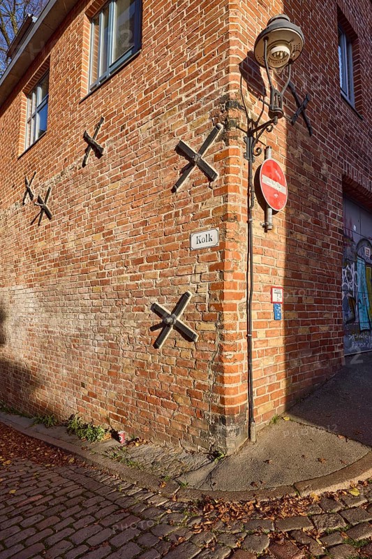 Wall anchor and lantern on a brick building, Kolk street, Hanseatic city of Lübeck, Schleswig-Holstein, Germany, Europe