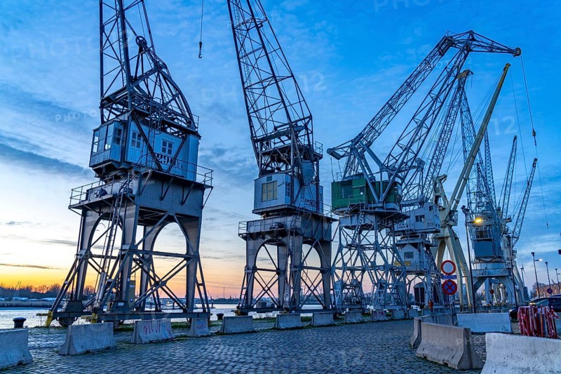 Harbour cranes on the Scheldekai, the world's largest collection of historic cranes, are part of the MAS, Museum aan de Stroom, Museum am Strom, Bonapartdok, in the Old Harbour Quarter, Het Eilandje of Antwerp, Flanders, Belgium, Europe