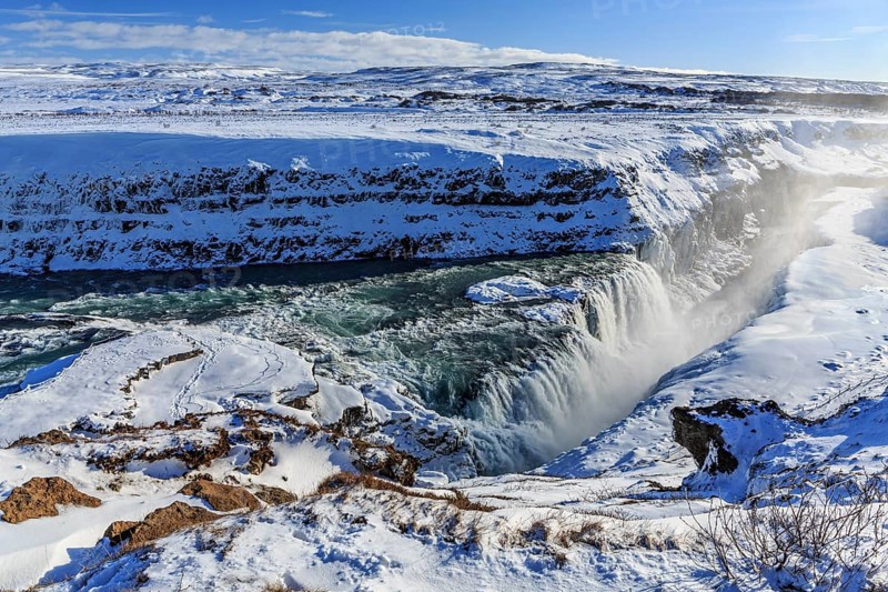 Large waterfall in a gorge in the snow, winter, sunny, spray, Gullfoss, Golden Circle, Southwest Iceland, Iceland, Europe