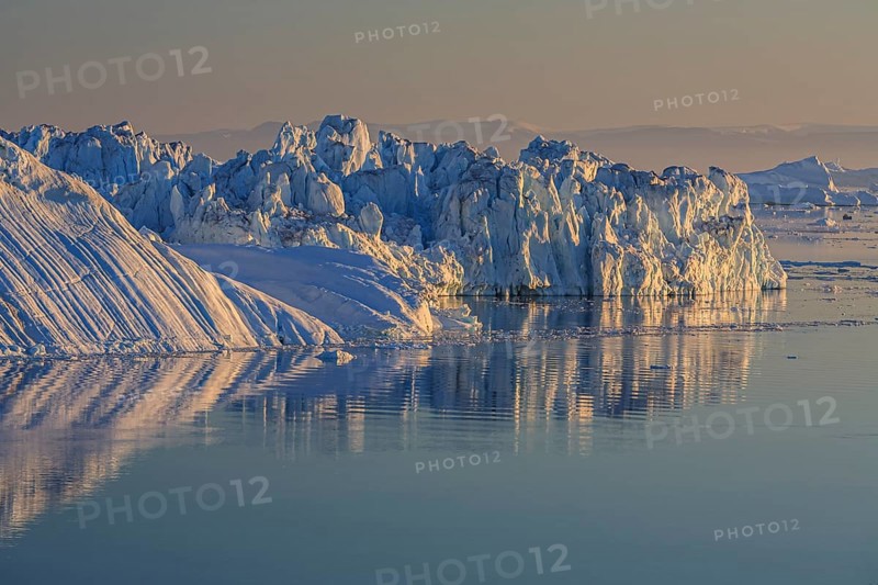 Icebergs and ice floes reflected in the water, summer, midnight sun, Jakobshavn glacier and ice fjord, Ilulissat Kangerlua, Disko Bay, West Greenland, Greenland, North America