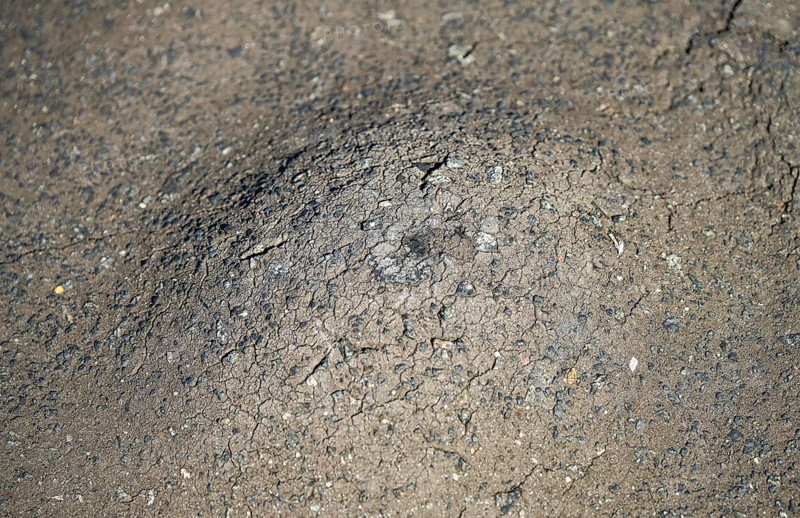 Road, bump in the asphalt