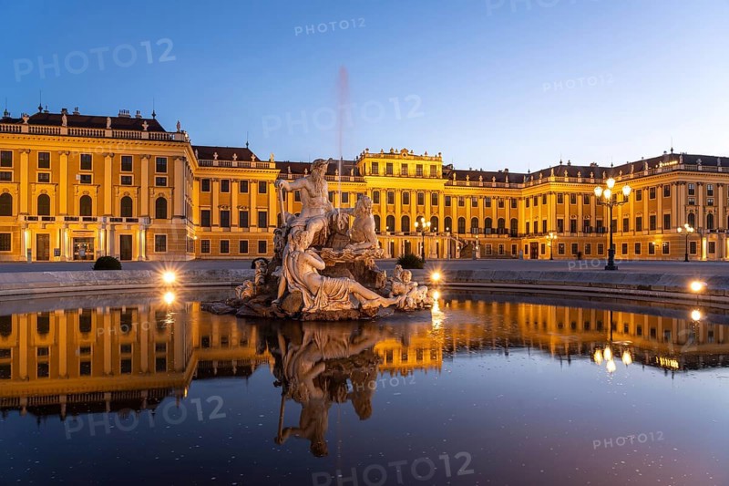 Fountain in the courtyard of honour at Schönbrunn Palace at dusk, UNESCO World Heritage Site in Vienna, Austria, Europe