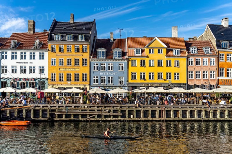 Colourful houses, restaurants and historic ships on the Nyhavn canal and harbour, Copenhagen, Denmark, Europe