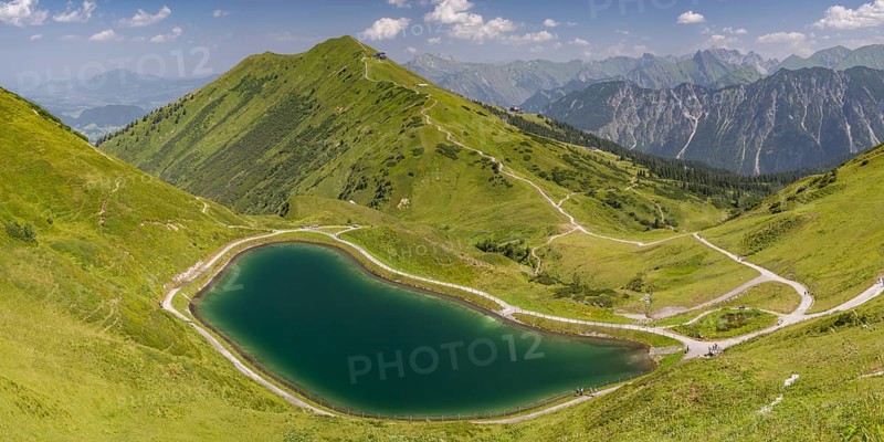 Riezler Alpsee, an artificial lake, snow pond, feeds the snow cannons that completely cover the slopes of the Fellhorn and Kanzelwand cable cars with snow, behind it the Fellhorn, 2038m, Allgäu Alps, Bavaria, Germany, Europe