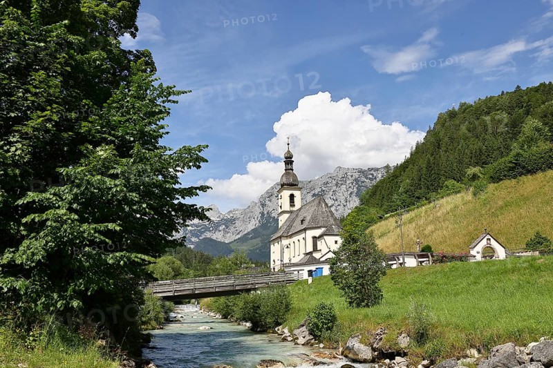 Parish church of St. Sebastian in autumn with Ramsauer Ache, Reiteralpe in the background, Ramsau, Berchtesgaden, Berchtesgadener Land, Upper Bavaria, Bavaria, Germany, Europe