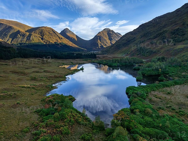 Mountains reflected in lake, morning light, sunny, autumn, aerial view, Lochan Urr, Glen Etive, Scottish Highlands, Scotland, Great Britain