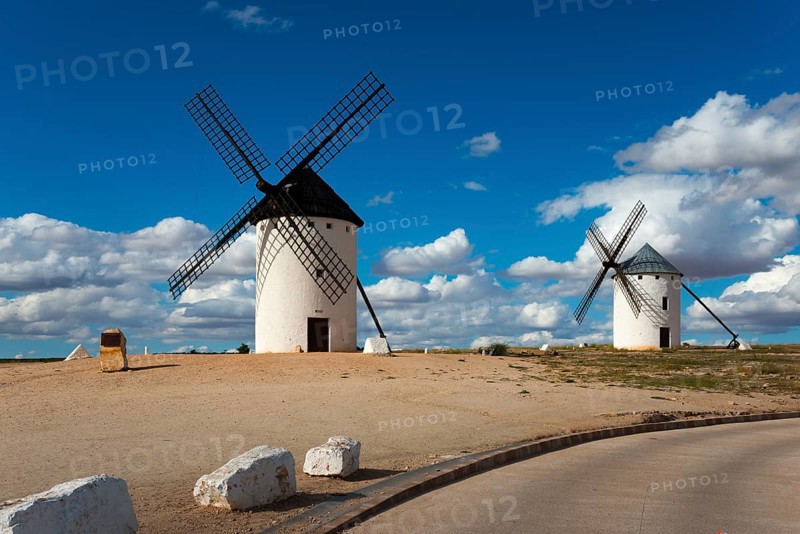 Two windmills on a hill under a blue sky with clouds, Campo de Criptana, Ciudad Real province, Castilla-La Mancha, Don Quixote Route, Spain, Europe