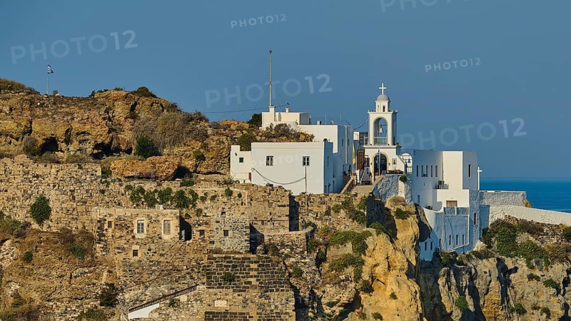 White church and building on a cliff overlooking the Mediterranean Sea on a sunny day, morning light, Panagia Spiliani, Castle, Mandraki, Nisyros, Dodecanese, Greek Islands, Greece, Europe