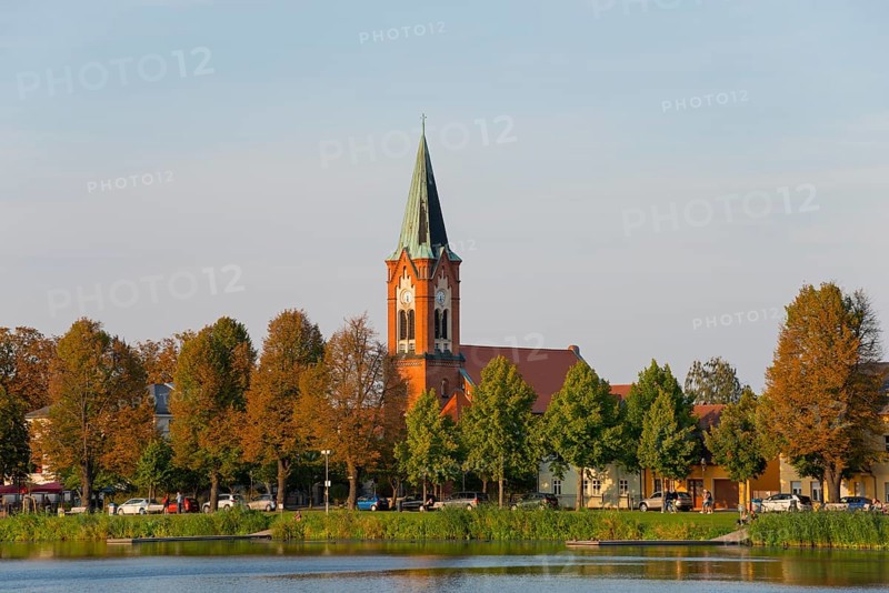 A church on the shore of a lake surrounded by colourful trees, Maria Meeresstern church, old town island of Werder in der Havel, Potsdam-Mittelmark, Brandenburg, Germany, Europe