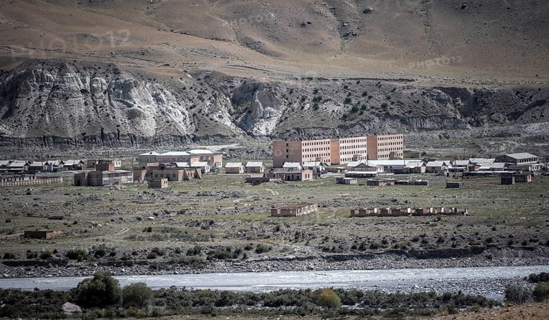 Abandoned ruined buildings in a mountain landscape, ghost town, Engilchek, Tian Shan, Kyrgyzstan, Asia