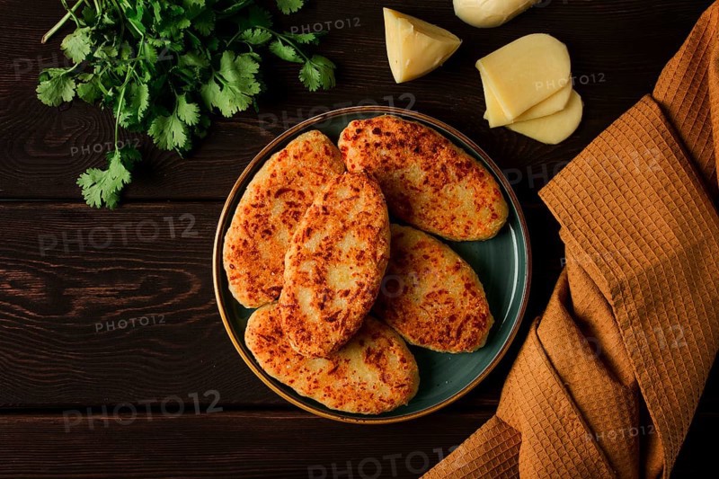 Chvishtari, corn flour tortillas with cheese, pastries, Georgian cuisine, Mchadi, homemade, top view, on a wooden table, no people