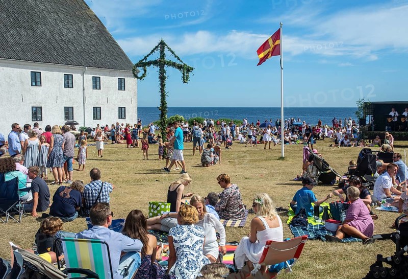 Traditional midsummer celebration with dancing around the maypole at Smygehuk, Smygehamn, Trelleborg Municipality, Skåne County, Sweden, Scandinavia, Europe