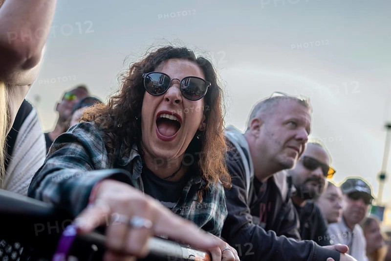 Adenau, Germany, 7 June 2024: Fans listen to Queens of the Stone Age at Rock am Ring. The festival takes place at the Nürburgring race track near the town of Adenau from 7 to 9 June 2024, Europe