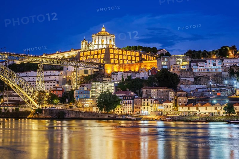 View of Vila Nova de Gaia city with Mosteiro da Serra do Pilar monastery and Dom Luis I bridge over Douro river in evening twilight. Porto, Vila Nova de Gaia, Portugal, Europe