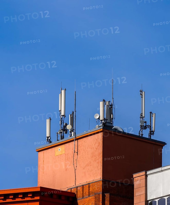 Transmission masts and mobile phone antennas on a rooftop, Berlin, Germany, Europe