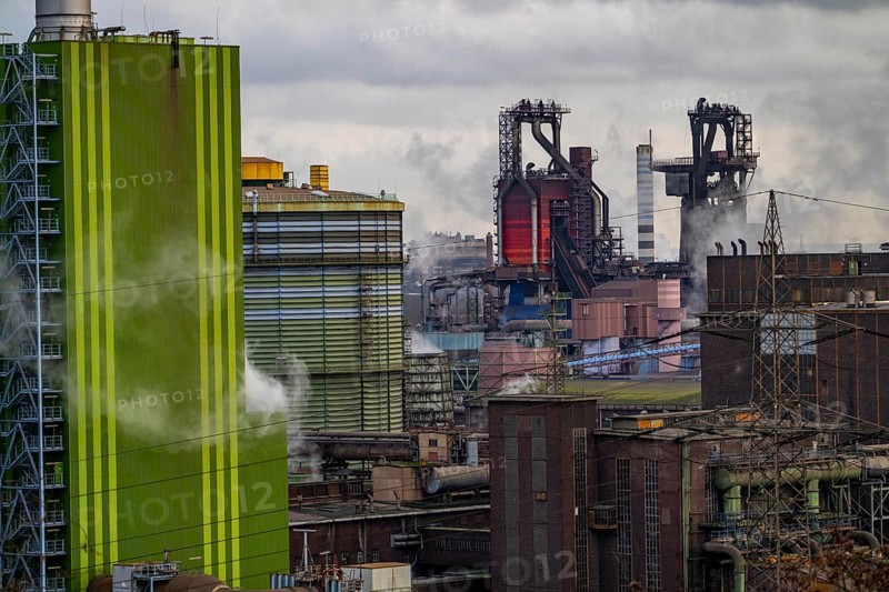 Panorama of the Thyssenkrupp Steel steelworks in Duisburg-Bruckhausen, in front the gas-fired power plant Hamborn, green facade of the boiler house Block5, in the centre the blast furnaces 8 and 9, North Rhine-Westphalia, Germany, Europe
