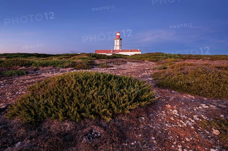Lighthouse on Cabo Espichel cape Espichel on Atlantic ocean at dusk evening twilight. Sesimbra, Portugal, Europe