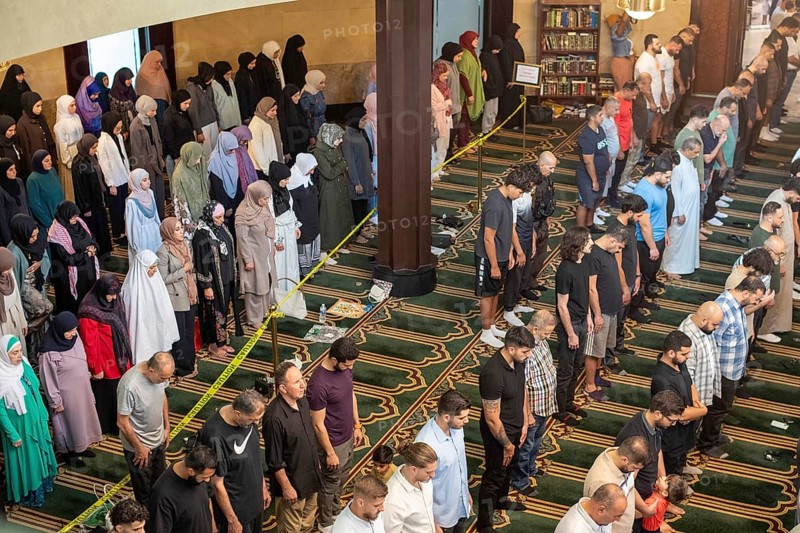 Dearborn, Michigan, Friday prayers at the Islamic Center of America, the largest mosque in North America. Women pray behind the caution tape or in the balcony