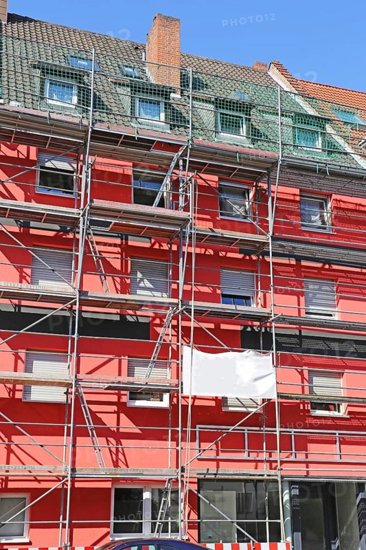 Painting work: Old building gets a new coat of paint