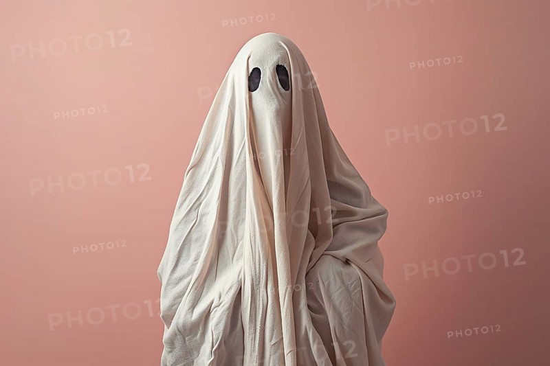 Person in simple Halloween Ghost costume made out of white blanket in front of pink background. Generative AI, AI generated