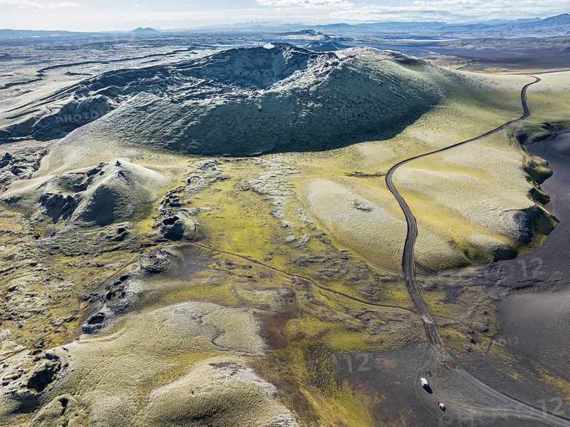 Mountain road F206 along moss-covered Laki crater or Lakagígar, series of craters, aerial view, interior highlands of Iceland, Suðurland, Iceland, Europe