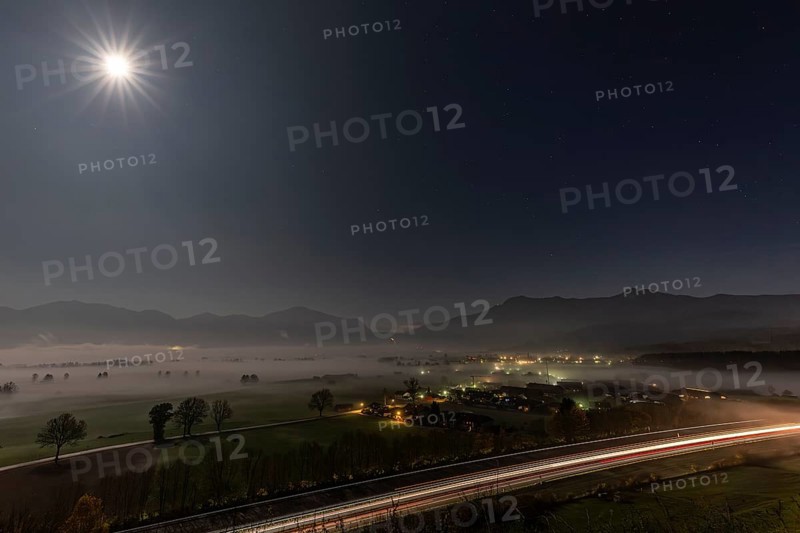 Night shot of a motorway, villages, full moon, fog, mountains, A 95, near Großweil, behind Jochberg, Herzogstand, Heimgarten, Bavaria, Germany, Europe