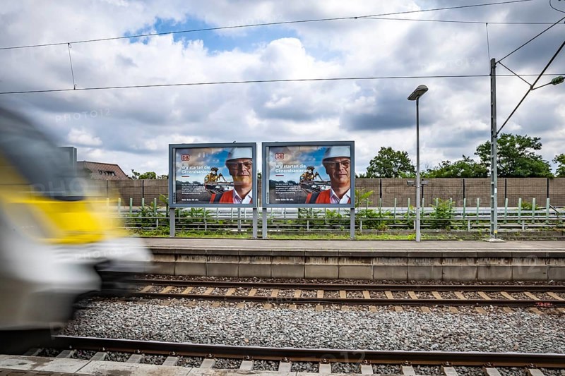 We are starting the general refurbishment. The railway wants to invest massively in tracks and infrastructure. Railway advertising posters at Zuffenhausen station, Stuttgart, Baden-Württemberg, Germany, Europe