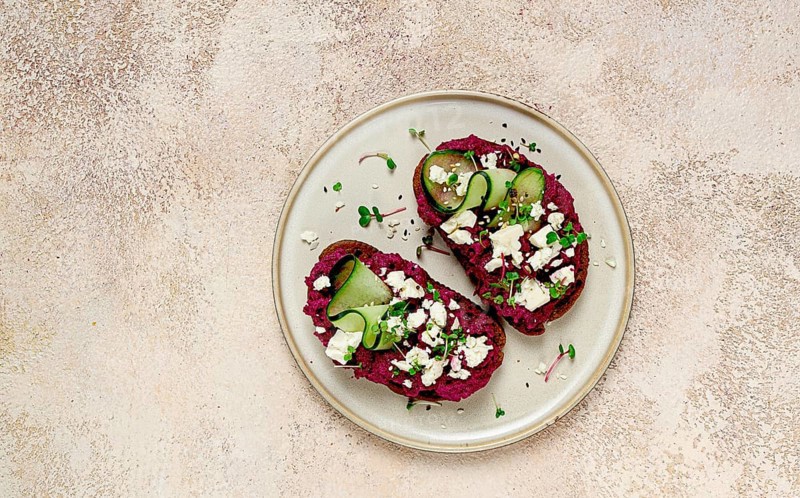 Sandwiches with beetroot hummus, cucumber and blue cheese, microgreens, rye bread, breakfast, homemade, no people