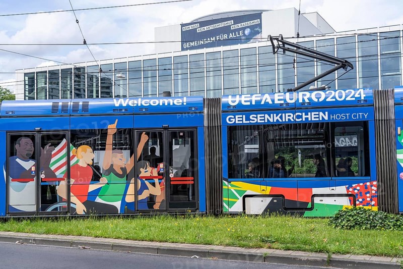 BOGESTRA tram running in the official design of the European Football Championship 2024, line 302, behind the MIR, Musiktheater im Revier, Gelsenkirchen, North Rhine-Westphalia, Germany, Europe
