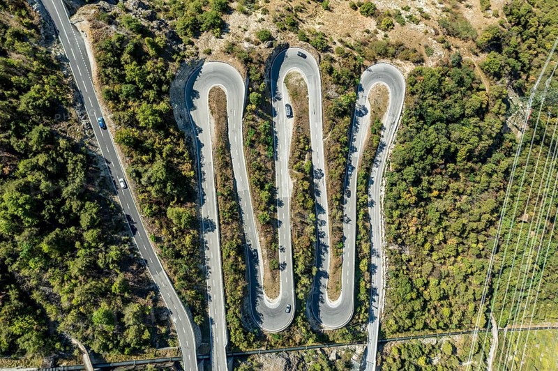 Aerial view, drone shot, Mountain pass road with multiple hairpins, water pipeline, Valais, Switzerland, Europe