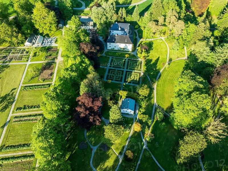 Aerial view of baroniet Rosendal in spring, castle and park, village Rosendal, Rogaland, Norway, Europe