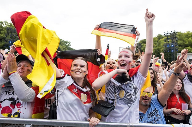 Celebrating football fans in the fan zone at the Brandenburg Tor during the quarter-final match between Germany and Spain at the European Football Championship, Berlin, 05.07.2024