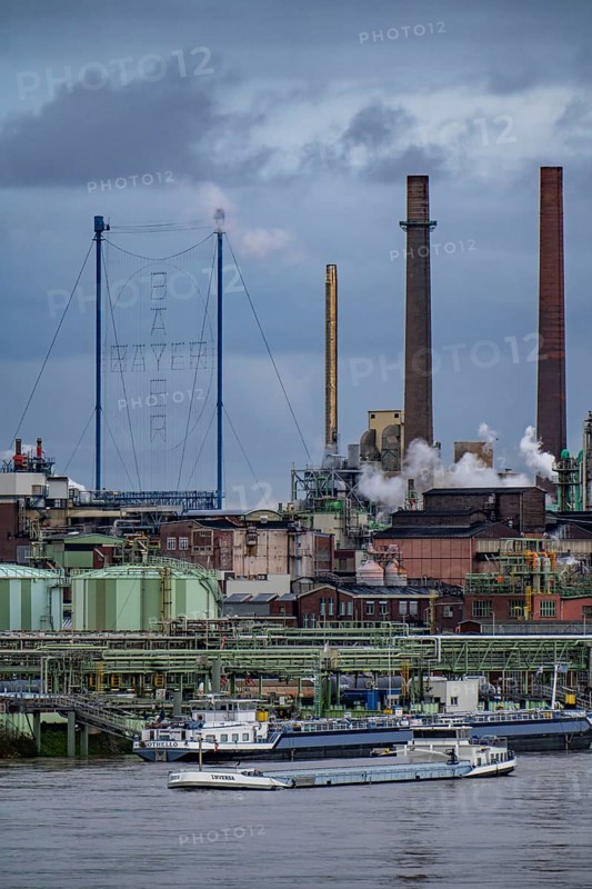 Backdrop of Chempark Leverkusen, Bayer Leverkusen, chemical park, chemical plant, river Rhine, cargo ship, Leverkusen, North Rhine-Westphalia, Germany, Europe
