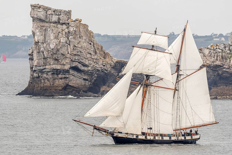 Large traditional sailing boat in a bay on the Atlantic during the Camaret sur mer sailing festival. Crozon, Finistere, Brittany, France, Europe